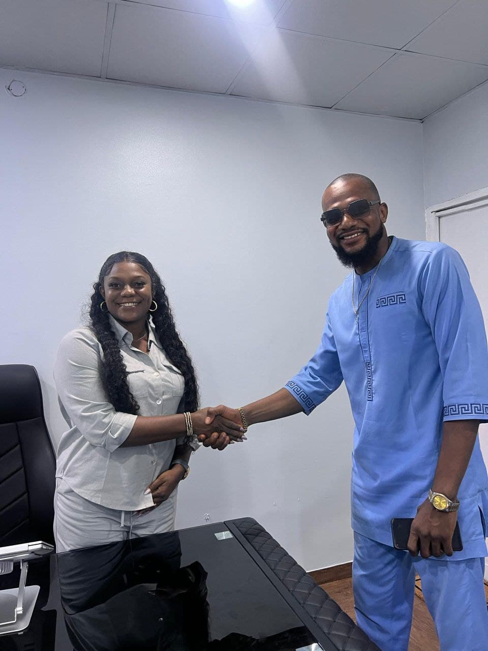 RealCommy Properties agent shaking hands with a client